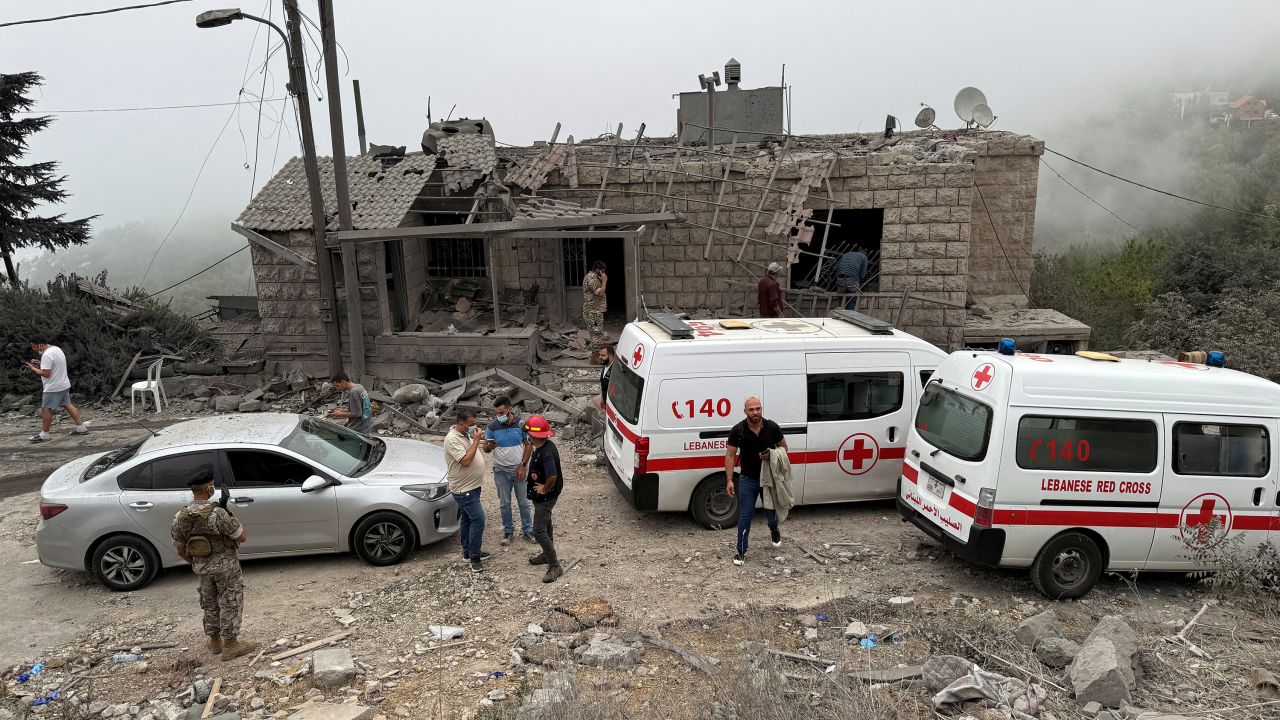 Lebanese Red Cross vehicles are parked at a site damaged by an Israeli air strike in the Christian-majority region of Aitou in north Lebanon, the Lebanese health ministry said, October 14, 2024. REUTERS/Omar Ibrahim

